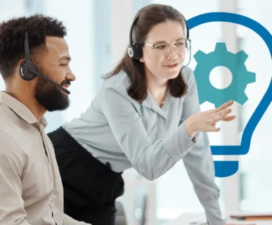 A male and female support professional wearing headsets collaborating in an office with a lightbulb and gear icon overlay, representing innovative and technical Customer service solutions.