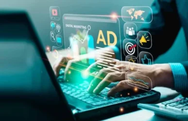 A person typing on a laptop with glowing holographic icons representing Digital marketing services, including ads, analytics, and social media growth.